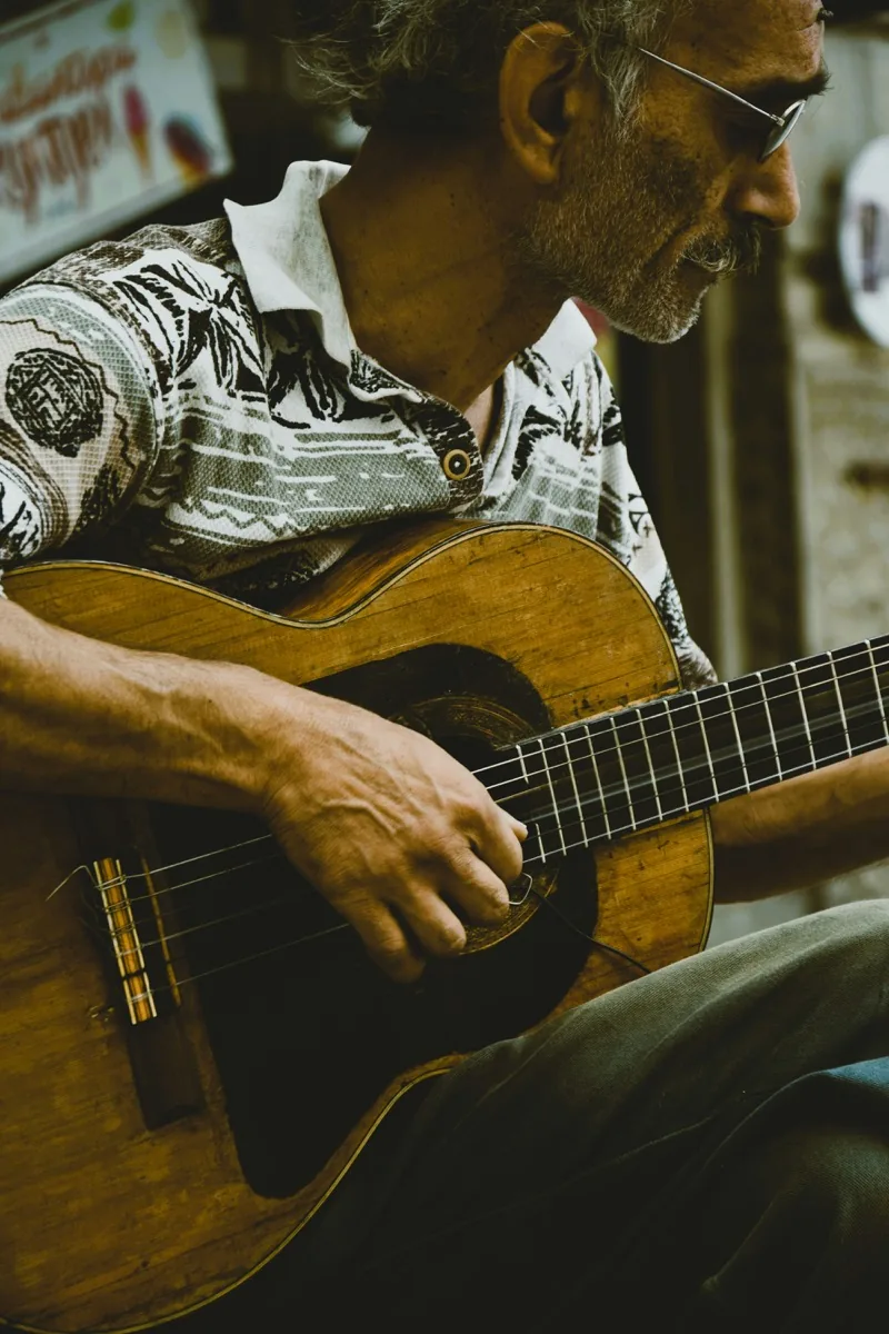 Guitar player focused on learning, an adult beginner making real progress