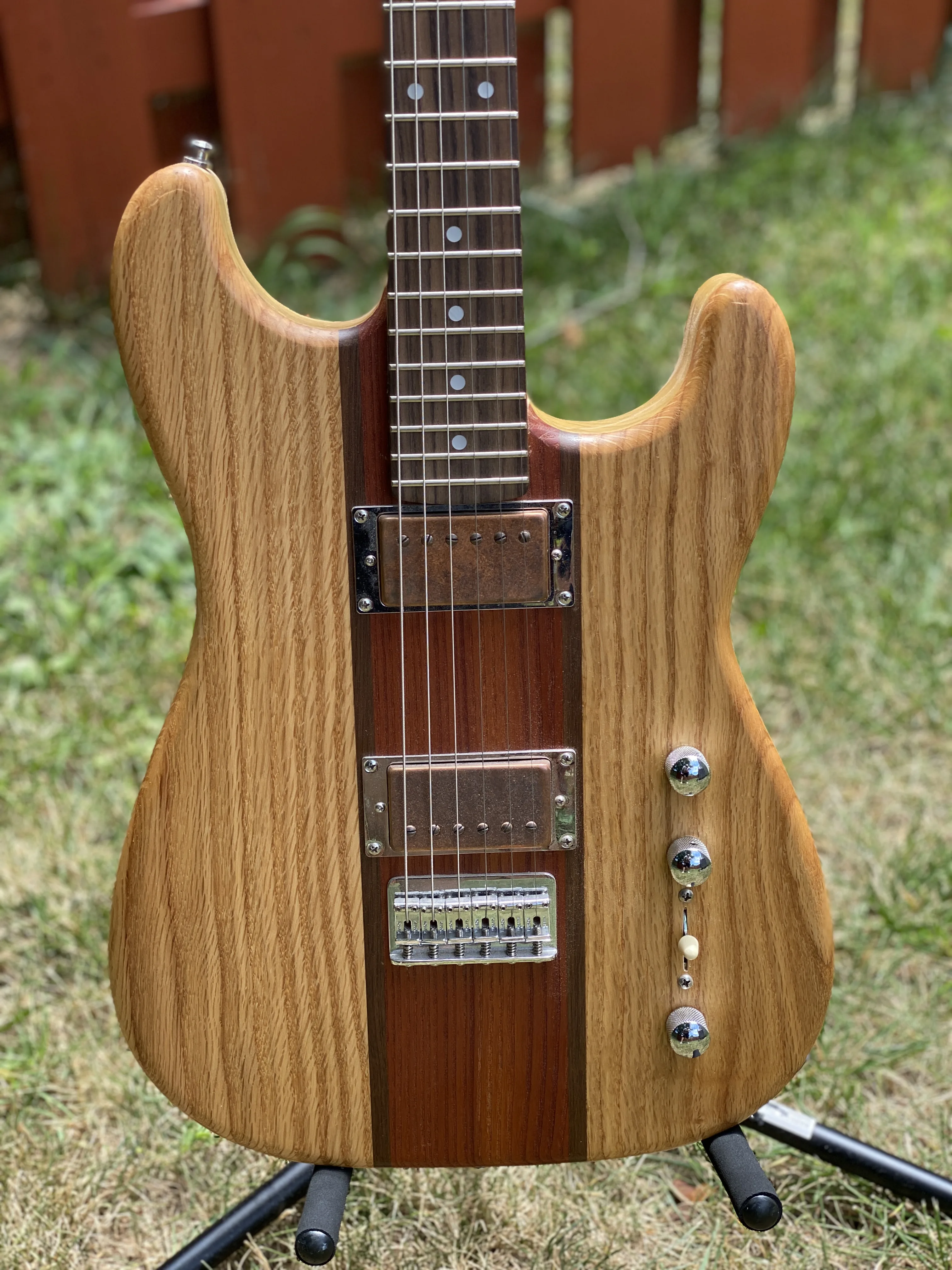 Boutique S-style guitar built at a shop in Maryland — natural oak and walnut body