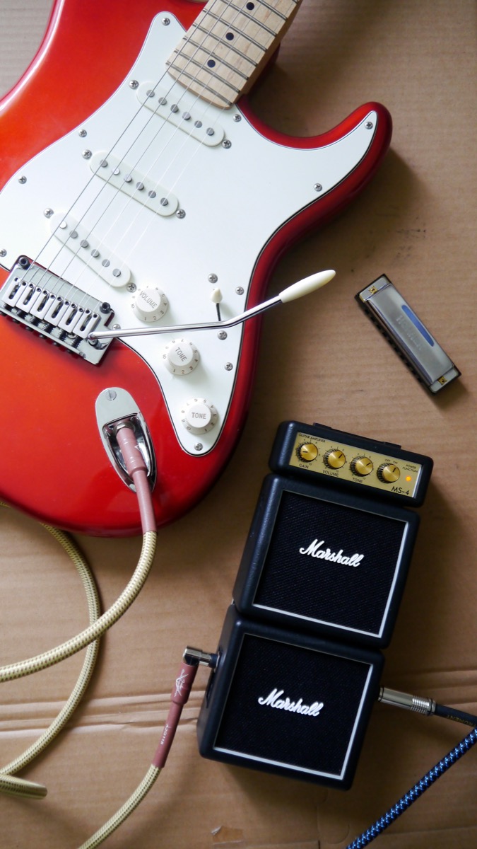 Close-up of a Stratocaster body — the refined details that boutique builders have pushed further than Fender