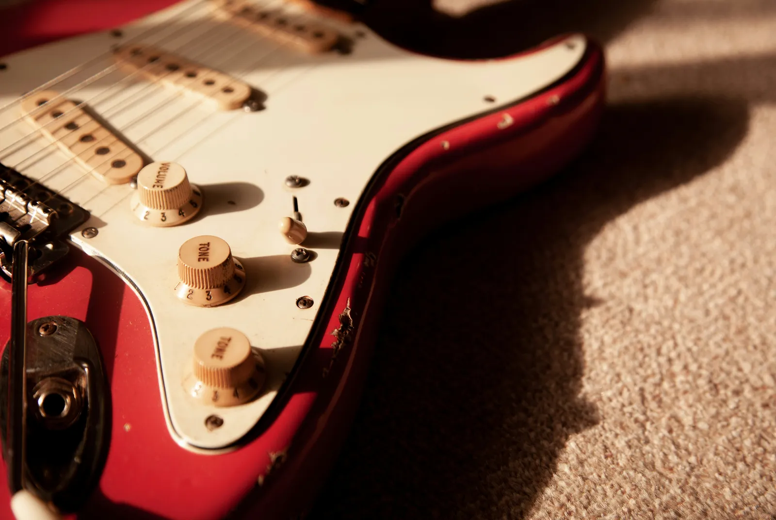 Close-up of a Fender Stratocaster body and pickups — the iconic shape now at the center of an ongoing legal dispute