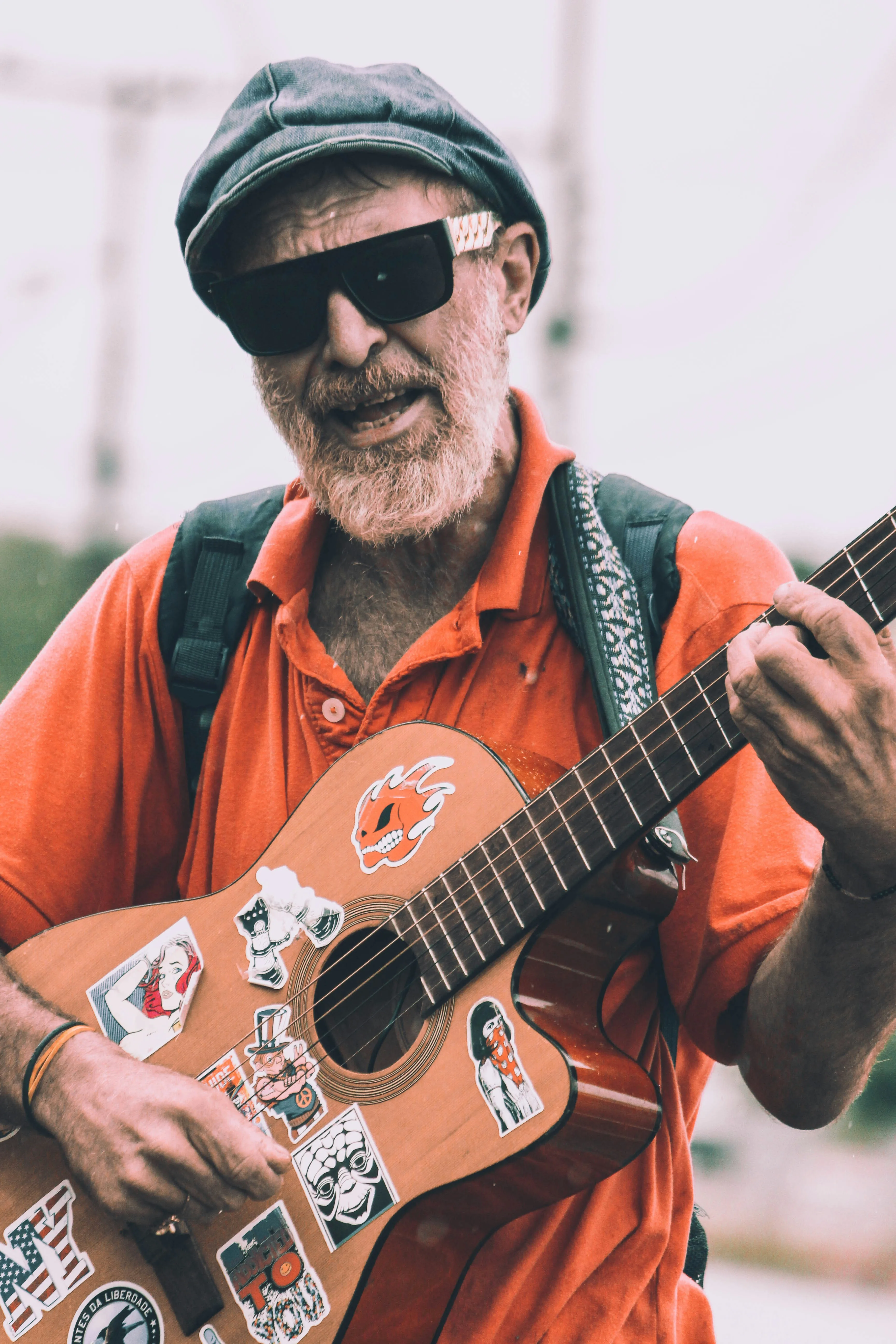 Older musician playing guitar with joy — guitar is about fun at any age