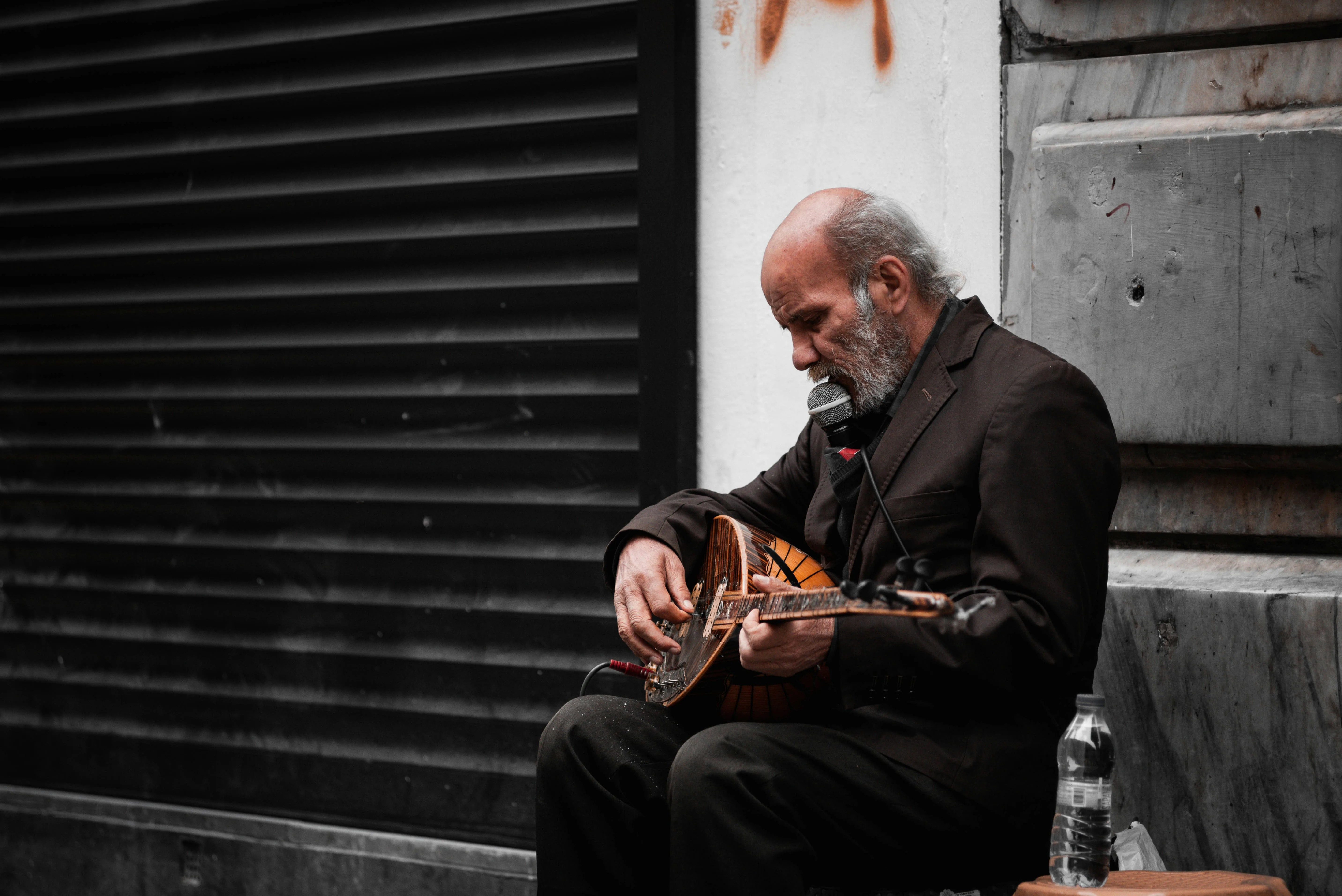 Older musician deeply focused while playing — overcoming ego to learn something new