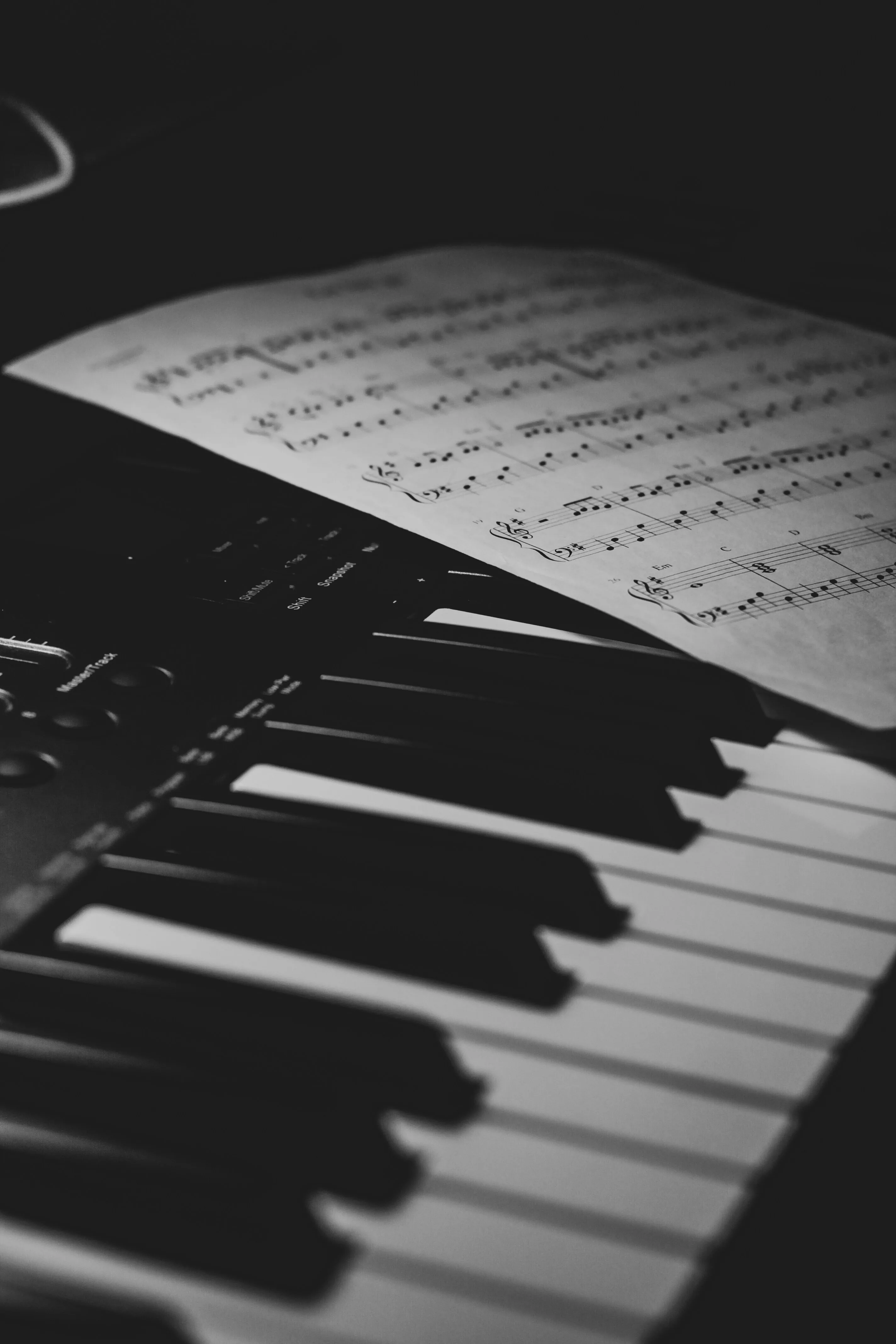 Piano keys and sheet music — the gap between knowing music and being able to play it