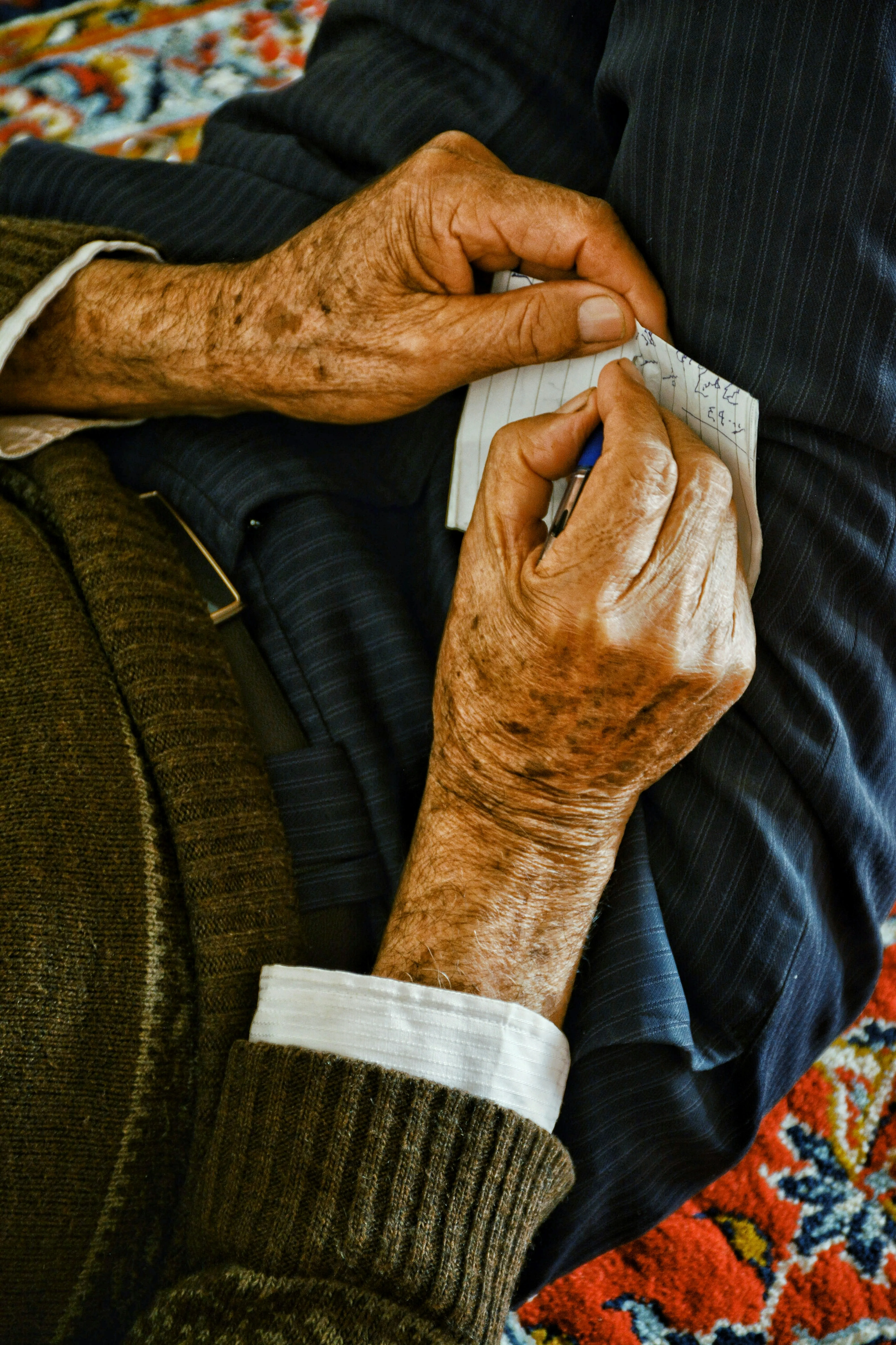 Close-up of aged, textured hands actively engaged — older hands can still play guitar with the right approach